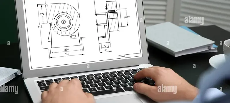 Engineer calculating total cost of ownership beside a filter sample Engineer calculating total cost of ownership beside a filter sample