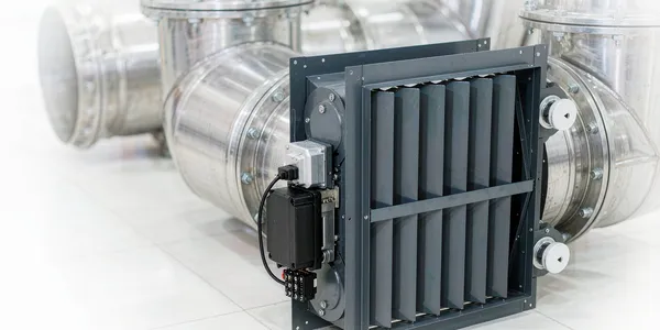 Combination fire and smoke damper with electric release actuator Combination fire and smoke damper with electric release actuator