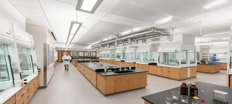 University teaching laboratory with multiple fume hoods shared exhaust University teaching laboratory with multiple fume hoods shared exhaust